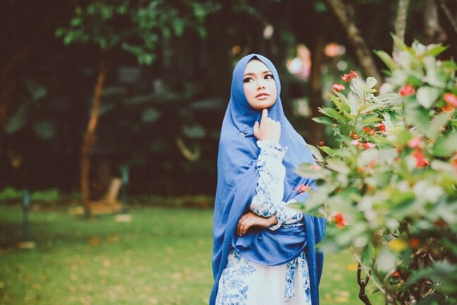 attractive muslima single standing in a garden